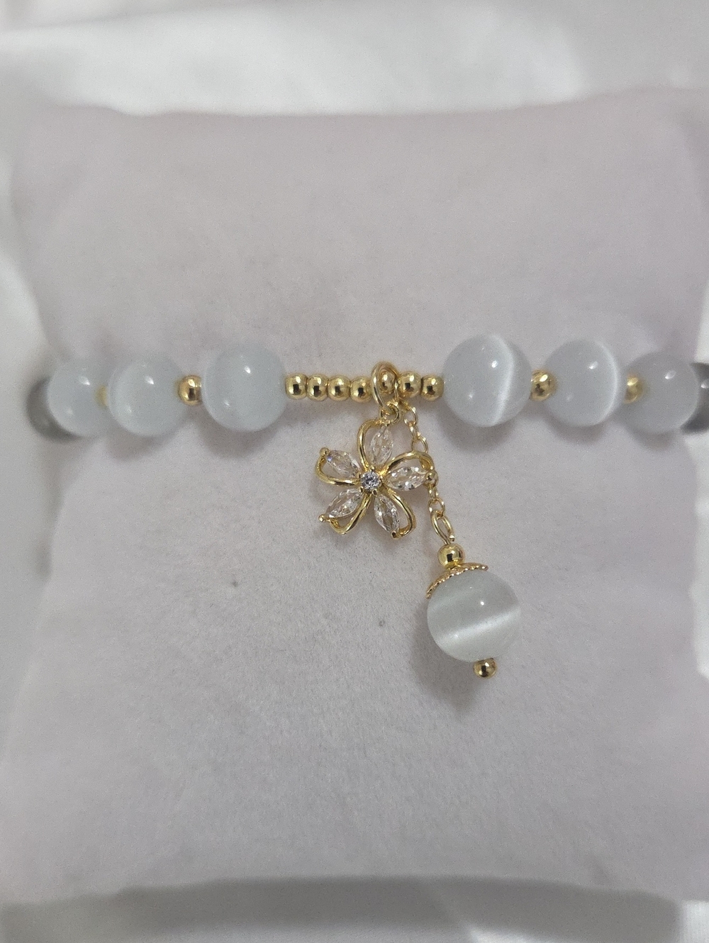 Elegant White Cat's Eye Bead Bracelet with Gold Flower Charm